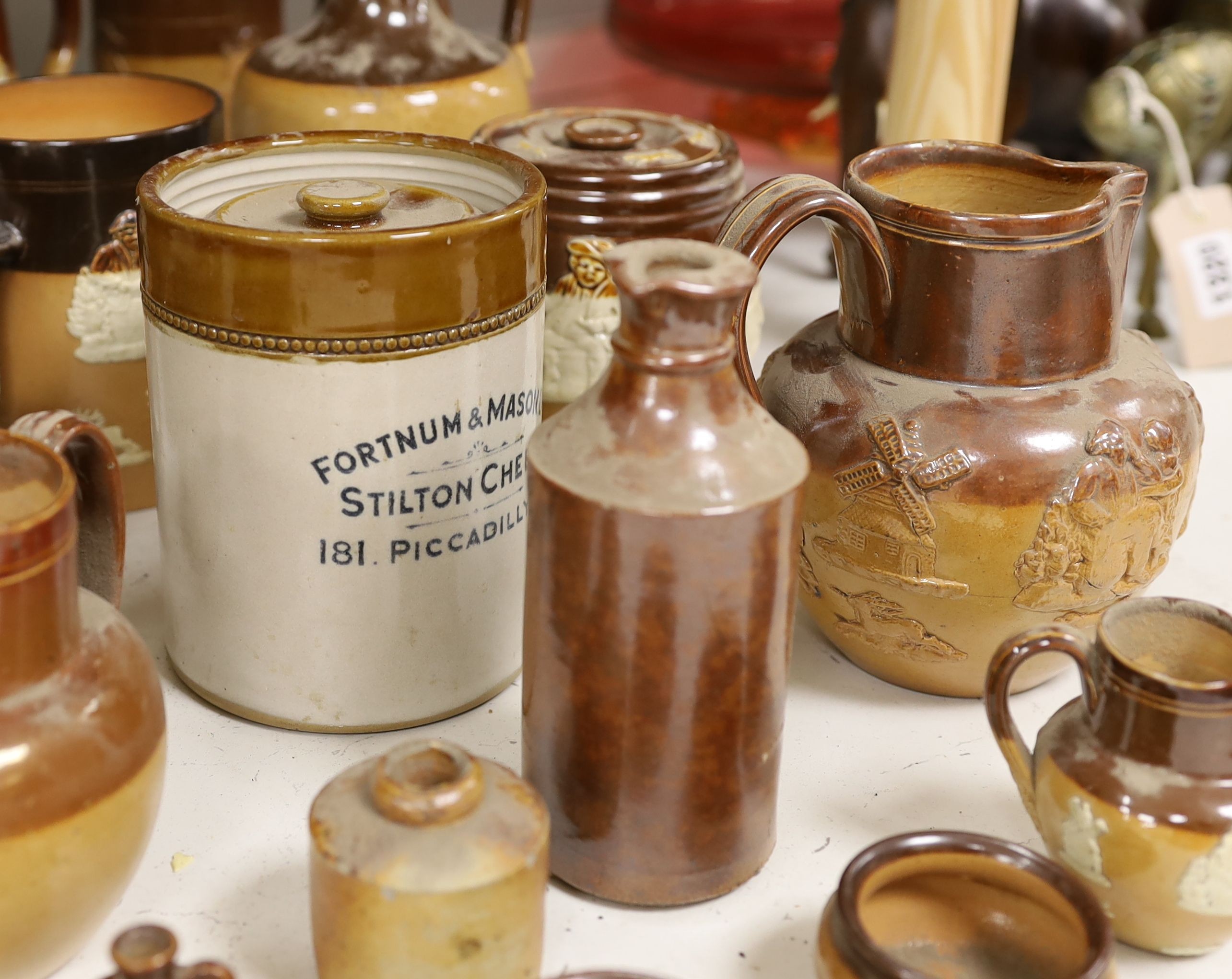 A quantity of Doulton stonewares including inkstand, jug, miniature salts and 19th century saltglaze pottery bottles, tallest item large jug 18 cms high.
